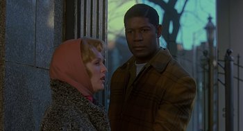 Movie still from “Far from Heaven” (2002), directed by Todd Haynes – A man and a woman standing next to each other; Medium shot, Over the shoulder angle