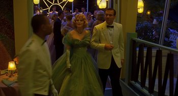 Movie still from “Far from Heaven” (2002), directed by Todd Haynes – A man and a woman dressed up for a formal event; Medium shot, Low angle