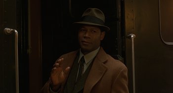 Movie still from “Far from Heaven” (2002), directed by Todd Haynes – A man wearing a suit and a hat; Close Up shot, Over the shoulder angle