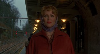 Movie still from “Far from Heaven” (2002), directed by Todd Haynes – A woman wearing a head scarf standing in a tunnel; Close Up shot, Low angle