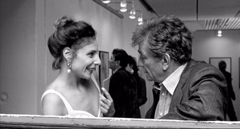 Movie still from “Faraway, So Close!” (1993), directed by Wim Wenders – An older man and a younger woman are talking; Medium shot, Over the shoulder angle