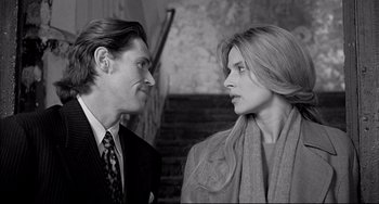 Movie still from “Faraway, So Close!” (1993), directed by Wim Wenders – A man and a woman talking to each other; Close Up shot, Over the shoulder angle