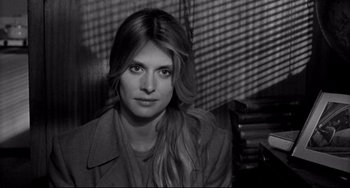 Movie still from “Faraway, So Close!” (1993), directed by Wim Wenders – Black and white photograph of a woman with long hair; Close Up shot, High angle