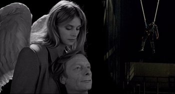 Movie still from “Faraway, So Close!” (1993), directed by Wim Wenders – A woman standing over a man's head in the dark; Close Up shot, Low angle