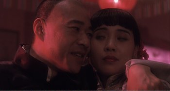 Movie still from “Farewell My Concubine” (1992), directed by Kaige Chen – A man and a woman posing for a picture; Close Up shot, Low angle