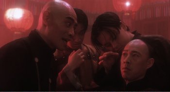Movie still from “Farewell My Concubine” (1992), directed by Kaige Chen – A group of people standing next to each other in a room; Close Up shot, Low angle