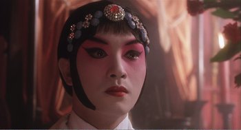 Movie still from “Farewell My Concubine” (1992), directed by Kaige Chen – A person wearing makeup; Close Up shot, Over the shoulder angle