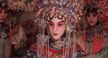 Movie still from “Farewell My Concubine” (1992), directed by Kaige Chen – A woman in a chinese costume and elaborate headdress; Close Up shot, Overhead angle