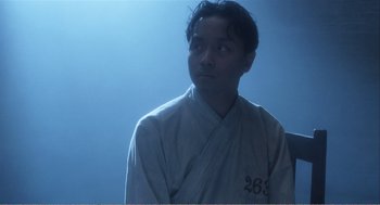 Movie still from “Farewell My Concubine” (1992), directed by Kaige Chen – A man in a white robe looking up at the sky; Close Up shot, Low angle