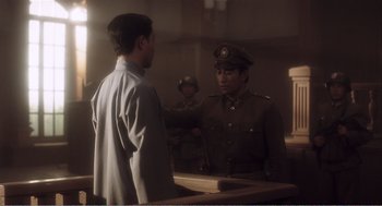 Movie still from “Farewell My Concubine” (1992), directed by Kaige Chen – Two men in military uniforms talking to each other; Medium shot, Over the shoulder angle