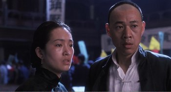 Movie still from “Farewell My Concubine” (1992), directed by Kaige Chen – A man and a woman standing next to each other; Close Up shot, Low angle