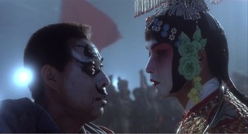 Movie still from “Farewell My Concubine” (1992), directed by Kaige Chen – A man and a woman dressed in traditional chinese clothing; Close Up shot, Low angle