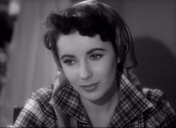 Movie still from “Father of the Bride” (1950), directed by Vincente Minnelli – An old photo of a woman in a plaid shirt; Close Up shot, High angle