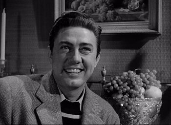 Movie still from “Father of the Bride” (1950), directed by Vincente Minnelli – An old photo of a man smiling for the camera; Close Up shot, Low angle