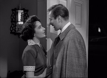 Movie still from “Father of the Bride” (1950), directed by Vincente Minnelli – An older man and a younger woman standing next to each other in front of a door; Medium shot, Low angle