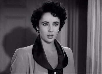 Movie still from “Father of the Bride” (1950), directed by Vincente Minnelli – A black - and - white photo of a woman in a dress; Close Up shot, High angle