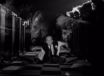 Movie still from “Father of the Bride” (1950), directed by Vincente Minnelli – A black - and - white photo of a man in a suit and tie; Medium shot, High angle