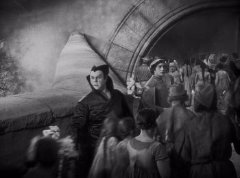 Movie still from “Faust” (1926), directed by F.W. Murnau – A black and white photo of a group of people; Wide shot, High angle