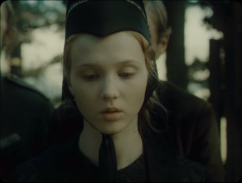 Movie still from “Faust” (2011), directed by Aleksandr Sokurov – The face of a young girl; Close Up shot, Over the shoulder angle