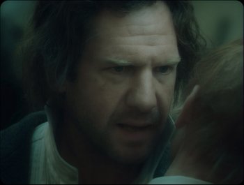 Movie still from “Faust” (2011), directed by Aleksandr Sokurov – A person with long hair; Close Up shot, Over the shoulder angle