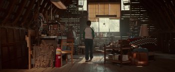 Movie still from “The Shack” (2017), directed by Stuart Hazeldine – A person standing in a room with a window; Wide shot, Low angle
