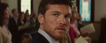 Movie still from “The Shack” (2017), directed by Stuart Hazeldine – A person wearing a suit and tie; Close Up shot, Over the shoulder angle