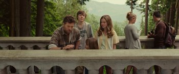 Movie still from “The Shack” (2017), directed by Stuart Hazeldine – A group of people standing on top of a stone wall; Medium shot, Over the shoulder angle