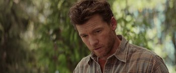 Movie still from “The Shack” (2017), directed by Stuart Hazeldine – A person wearing a plaid shirt; Close Up shot, Over the shoulder angle