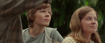 Movie still from “The Shack” (2017), directed by Stuart Hazeldine – A young man looking up at a young woman; Close Up shot, Over the shoulder angle
