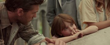 Movie still from “The Shack” (2017), directed by Stuart Hazeldine – A little girl sitting next to an older man; Close Up shot, Over the shoulder angle