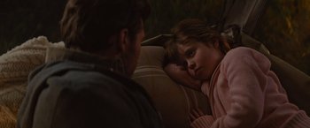 Movie still from “The Shack” (2017), directed by Stuart Hazeldine – A little girl laying on a couch next to a man; Close Up shot, Over the shoulder angle
