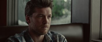 Movie still from “The Shack” (2017), directed by Stuart Hazeldine – A person wearing a plaid shirt; Close Up shot, Over the shoulder angle