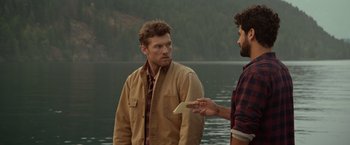 Movie still from “The Shack” (2017), directed by Stuart Hazeldine – Two men standing next to each other near a body of water; Medium shot, Over the shoulder angle