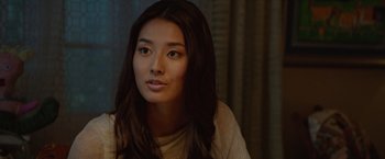 Movie still from “The Shack” (2017), directed by Stuart Hazeldine – A beautiful young lady sitting in front of a window; Close Up shot, Over the shoulder angle