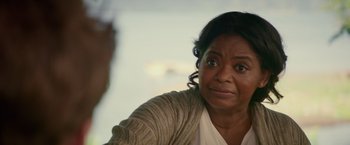 Movie still from “The Shack” (2017), directed by Stuart Hazeldine – An older black woman looking at the camera; Close Up shot, Over the shoulder angle