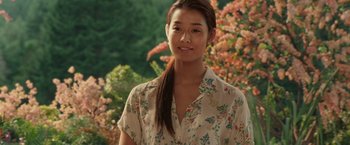 Movie still from “The Shack” (2017), directed by Stuart Hazeldine – A young woman standing in front of some trees; Close Up shot, Over the shoulder angle