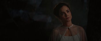 Movie still from “The Shack” (2017), directed by Stuart Hazeldine – A woman in a white dress is standing in the dark; Close Up shot, Over the shoulder angle