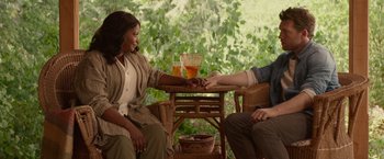 Movie still from “The Shack” (2017), directed by Stuart Hazeldine – Two people sitting at a table with a glass of tea; Medium shot, Over the shoulder angle