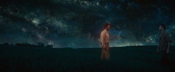 Movie still from “The Shack” (2017), directed by Stuart Hazeldine – A man standing in the middle of a grassy field; Extreme Wide shot, Low angle