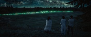 Movie still from “The Shack” (2017), directed by Stuart Hazeldine – Two people standing in a field at night; Extreme Wide shot, High angle