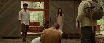 Movie still from “The Shack” (2017), directed by Stuart Hazeldine – A woman standing in front of a man in front of a window; Wide shot, Over the shoulder angle