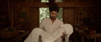 Movie still from “The Shack” (2017), directed by Stuart Hazeldine – A man holding a white cloth in his hands; Medium shot, Low angle