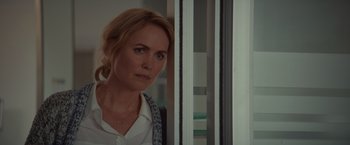 Movie still from “The Shack” (2017), directed by Stuart Hazeldine – A woman standing in front of a window; Close Up shot, Over the shoulder angle