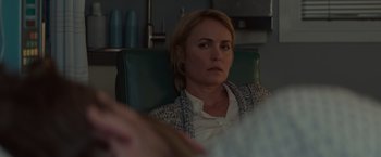 Movie still from “The Shack” (2017), directed by Stuart Hazeldine – A woman sitting in a green chair in front of a mirror; Close Up shot, Over the shoulder angle