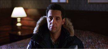 Movie still from “Fear X” (2003), directed by Nicolas Winding Refn – A person wearing a jacket; Close Up shot, Low angle