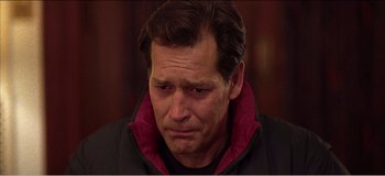 Movie still from “Fear X” (2003), directed by Nicolas Winding Refn – A person wearing a jacket; Close Up shot, Low angle