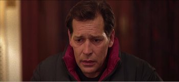 Movie still from “Fear X” (2003), directed by Nicolas Winding Refn – A person wearing a jacket; Close Up shot, Low angle