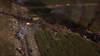 Movie still from “Fearless” (1993), directed by Peter Weir – An aerial view of a forest fire with a lot of debris; Extreme Wide shot, Overhead angle