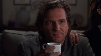 Movie still from “Fearless” (1993), directed by Peter Weir – A person holding a cup of coffee; Close Up shot, Over the shoulder angle