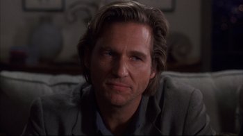 Movie still from “Fearless” (1993), directed by Peter Weir – A person with long brown hair; Close Up shot, Over the shoulder angle